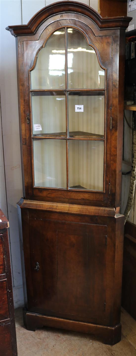 Feather banded walnut standing corner cupboard